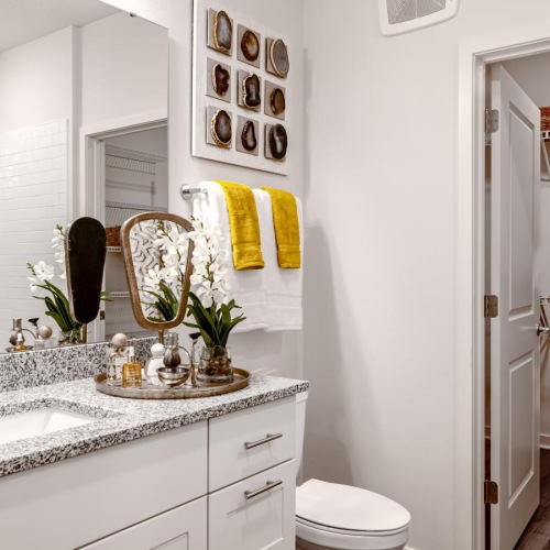 a bathroom with a tub sink and toilet
