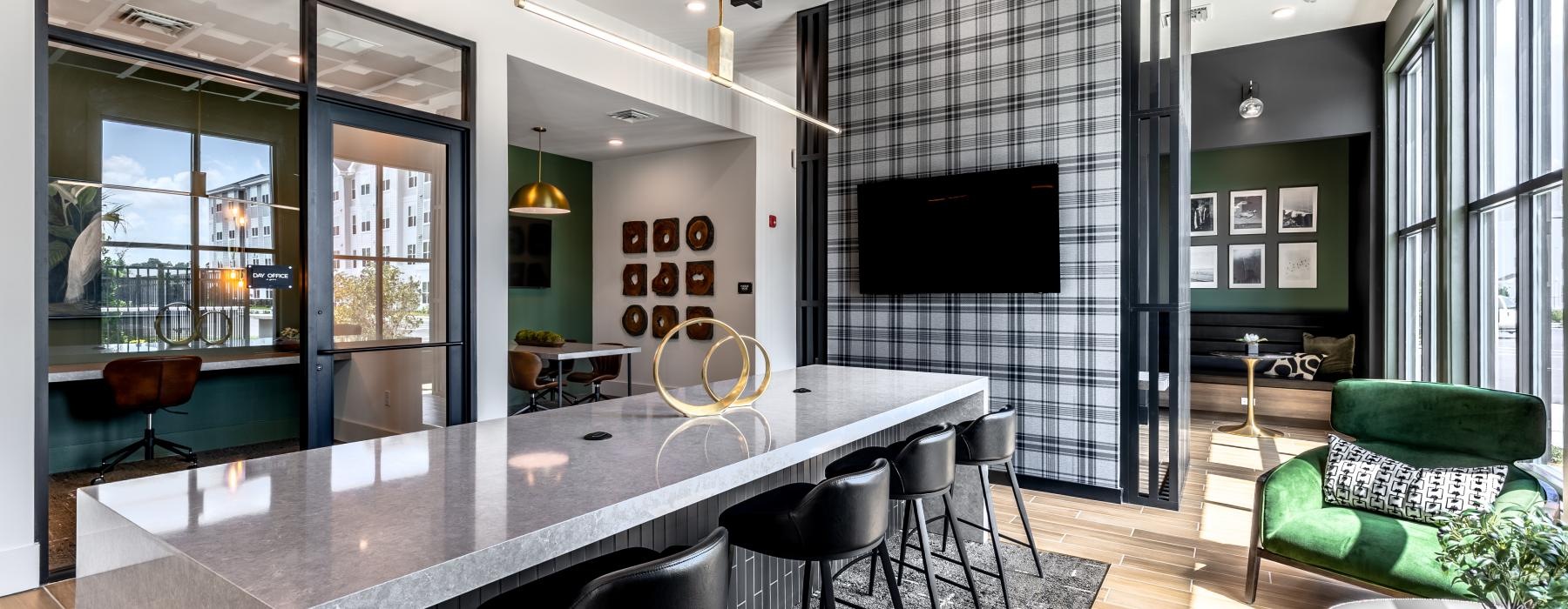 a kitchen with a tv large table and chairs