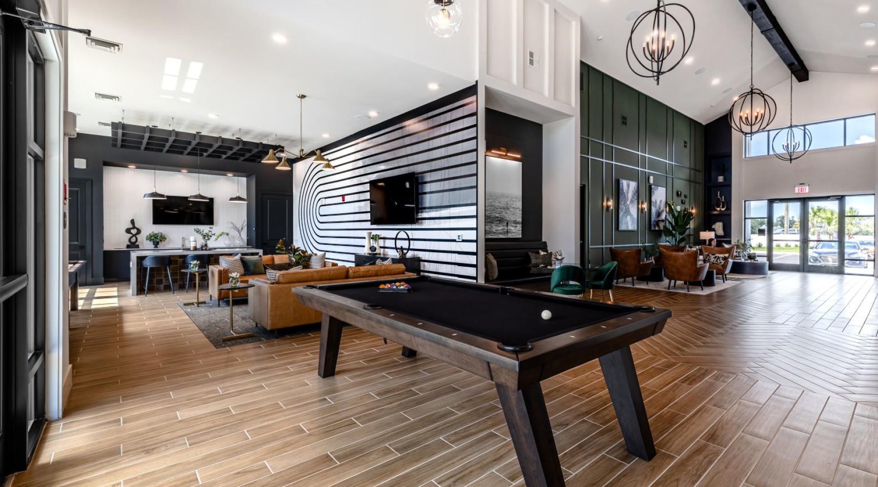 a large kitchen pool table tvs and seating